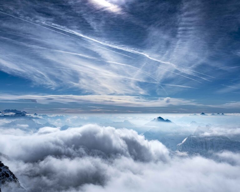 A sea of cloud with contrails